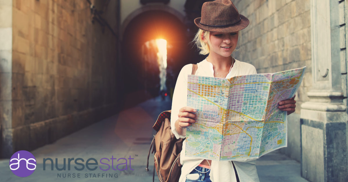 woman with map exploring as a travel nurse