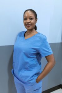 Nurse smiling because she switched travel nurse companies