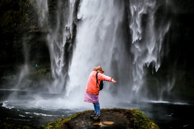 travel nurse enjoying waterfall after working with travel nurse companies to find assignments in interesting detinations